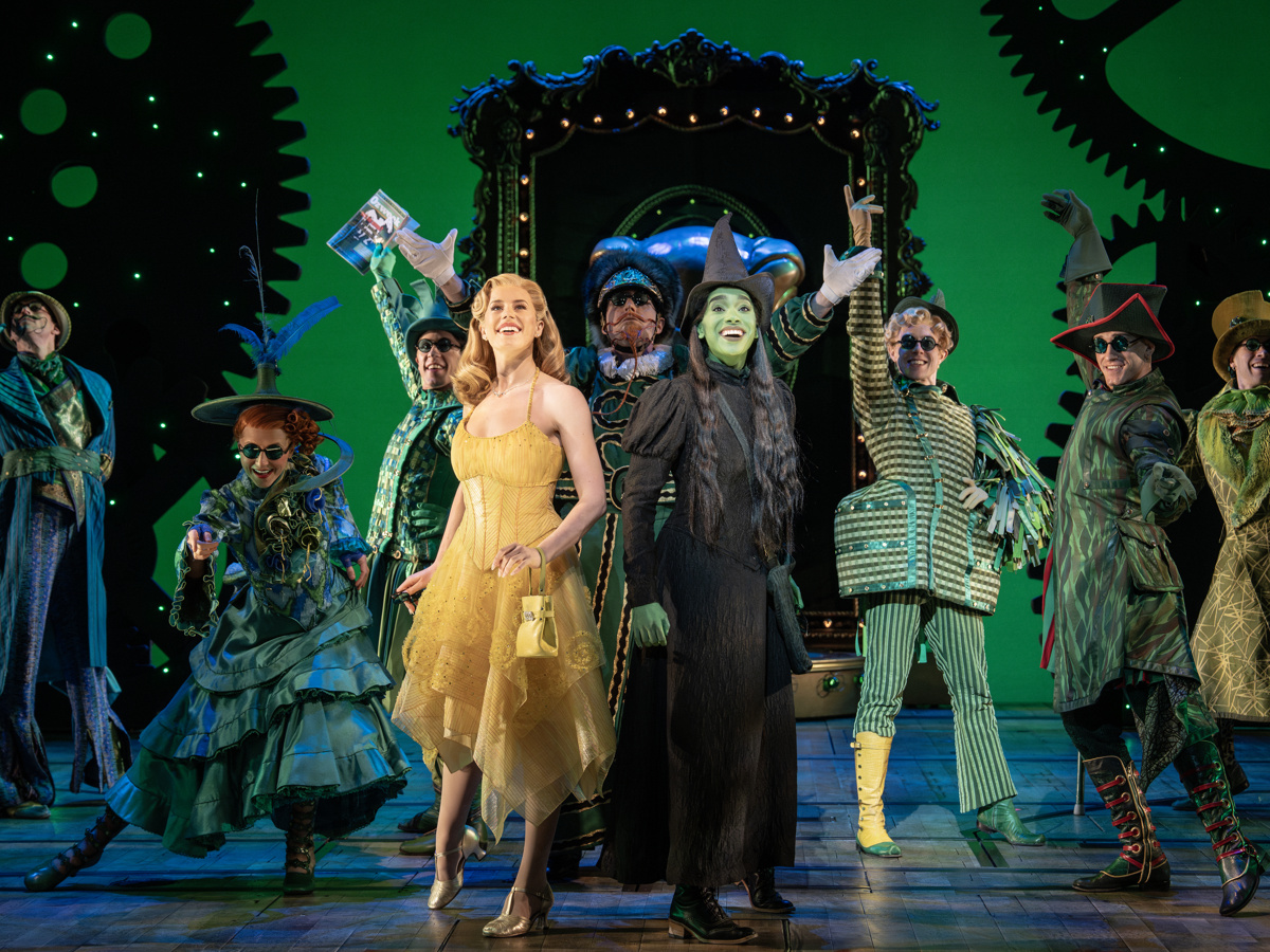 Allie Trimm as Glinda and Lencia Kebede as Elphaba arrive in the Emerald City in Wicked on Broadway