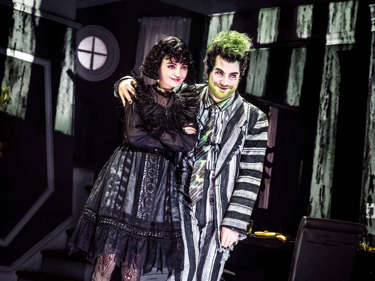 Isabella Esler as Lydia and Justin Collette as Beetlejuice stand together